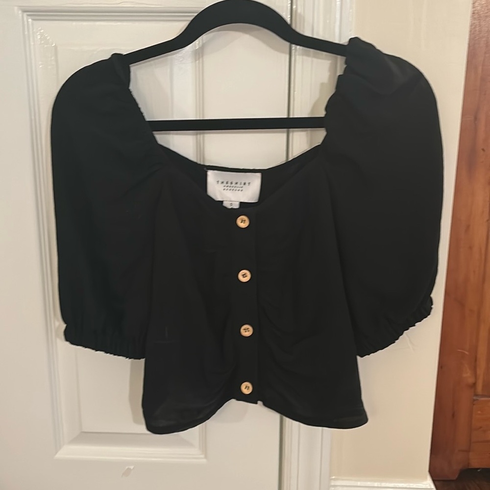THE SHIRT. Black short sleeved shirt with wooden buttons. Never worn.